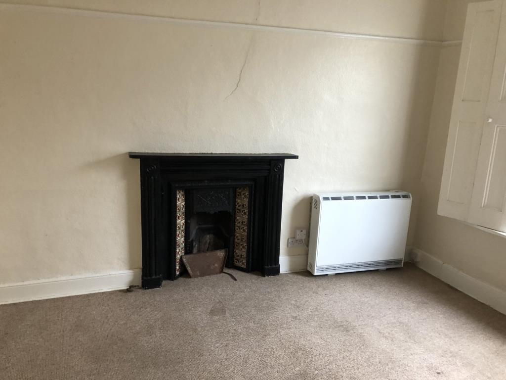 Lot: 56 - FREEHOLD MIXED INVESTMENT - Living room photo of the flat at 10-11 High Street Ryde Isle of Wight